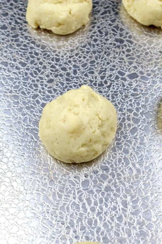 Gluten-Free Ricotta Cookies Process Step 4b A close-up of a single gluten-free ricotta cookie to show when it is finished baking. Note the slightly golden exterior.